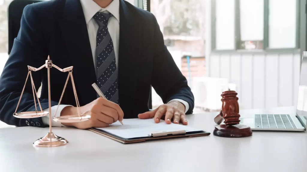 a chicago personal injury lawyer signing a document on the table