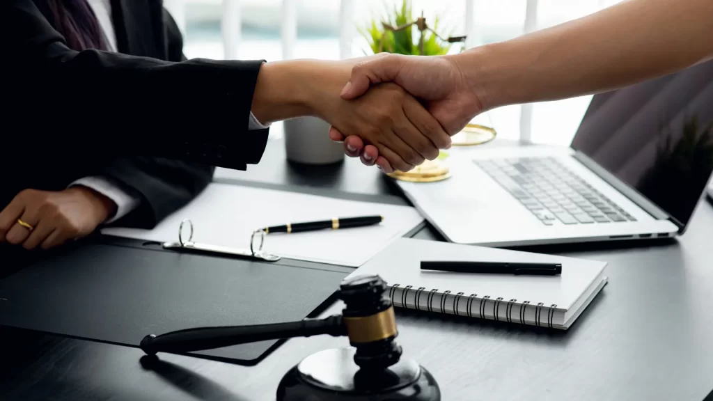 personal injury attorney shaking hands with a man