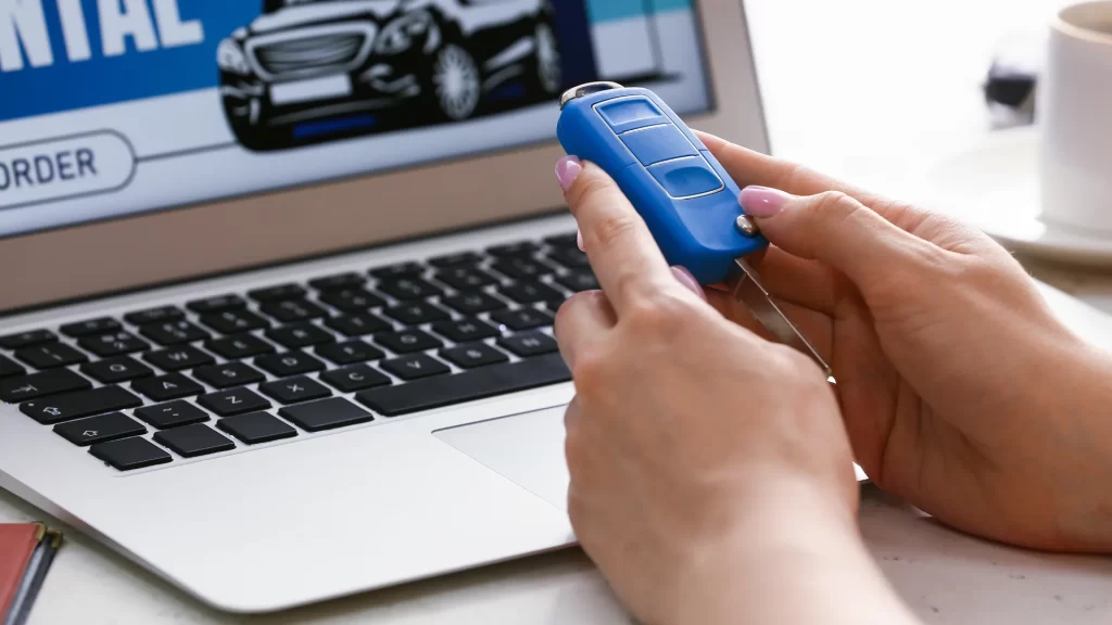 a person holding a car key